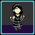 Aydan, as described below, stands in a room of grey and violet.