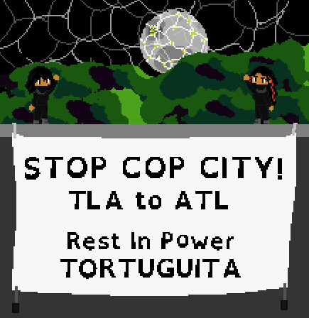 Liáo Saffron and Sabrina Salah deploy a banner from a building on Translunar Academy: STOP COP CITY! TLA to ATL Rest in Power TORTUGUITA